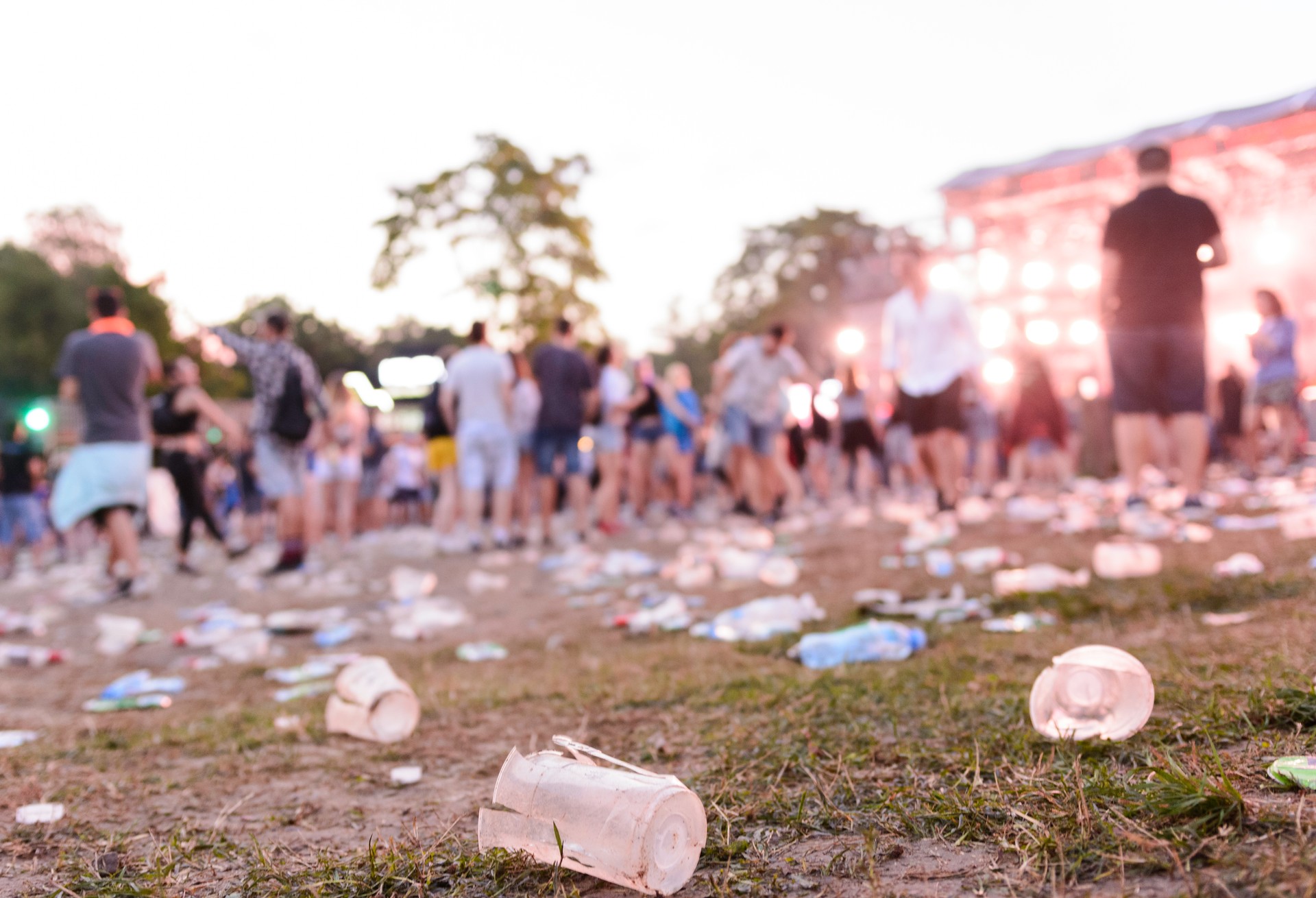 After party - empty glasses and garbage on the ground